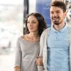 Young Couple At Dealer Showroom Stock Photo
