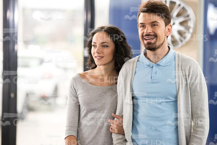 Young Couple At Dealer Showroom Stock Photo