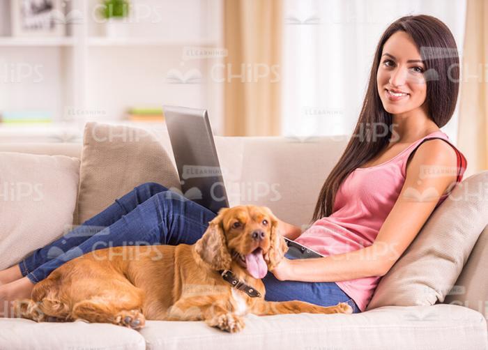 Handsome Girl Resting With Her Dog Stock Photo