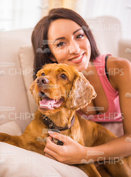Smiling Woman Hugs Her Dog Stock Photo