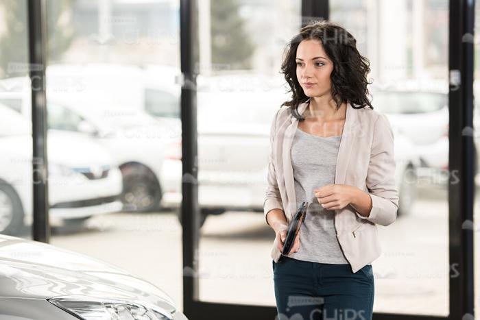 Woman Looking For New Car Stock Photo