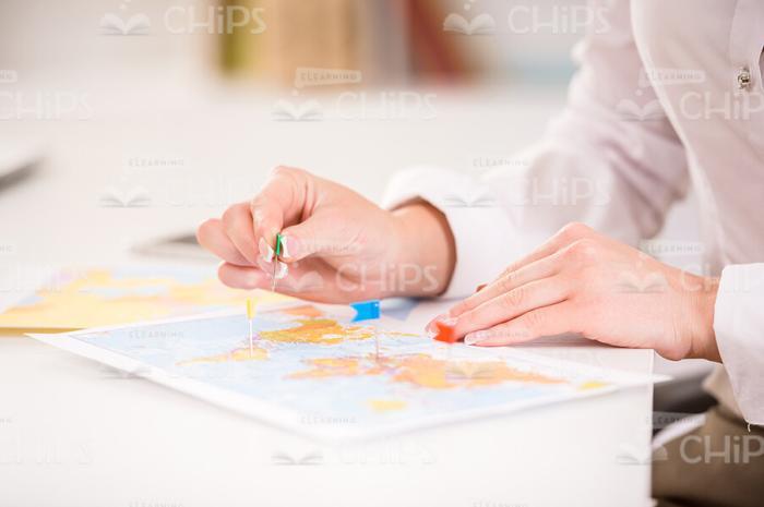 Woman's Hands Put Markers On Map Stock Photo