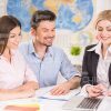 Female Manager Showing Something To Her Clients Stock Photo