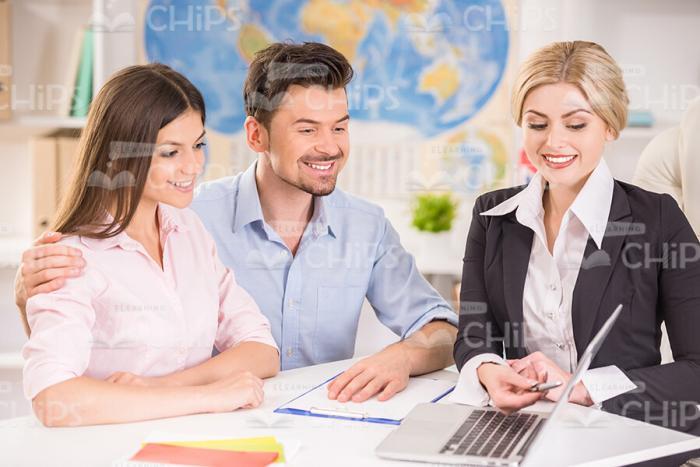 Female Manager Showing Something To Her Clients Stock Photo