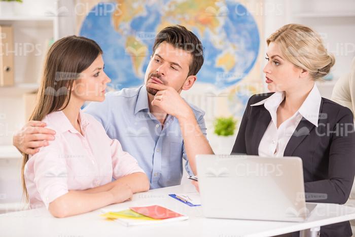 Displeased Young Lady Looks At Manager Stock Photo