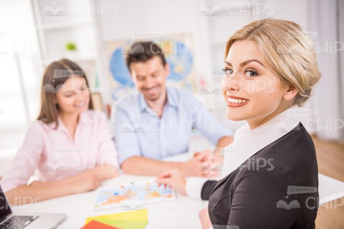 Female Manager With Clients Stock Photo