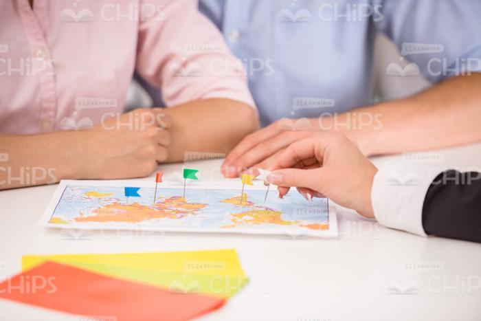 Manager's Hand Setting Markers On Map Stock Photo