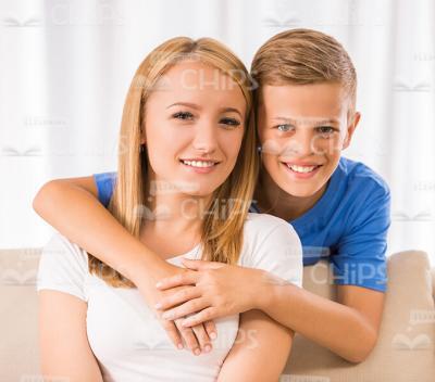 Young Boy Hugging His Mother Stock Photo