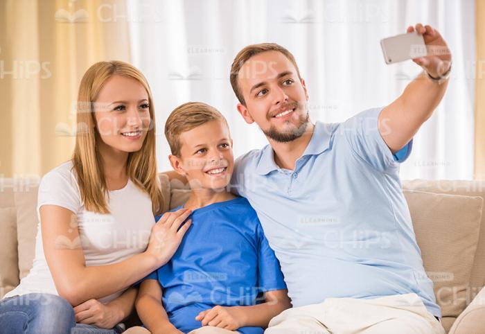 Nice Young Family Taking Selfie Together Stock Photo