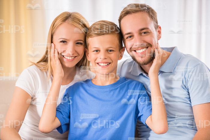 Young Parents And Their Little Son At Home Stock Photo