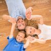 Happy Family Lying On Floor Stock Photo