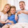 Happy Family Watching TV Stock Photo