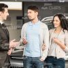 Seller Talks With Customers Stock Photo