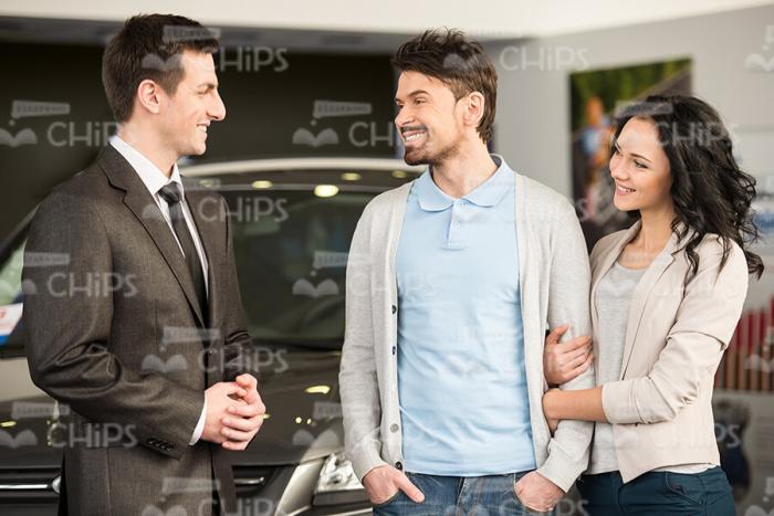 Sales Manager and Buyers Holding Conversation Stock Photo
