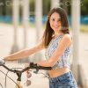 Young Woman With Bike Stock Photo
