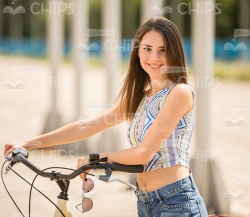 Young Woman With Bike Stock Photo