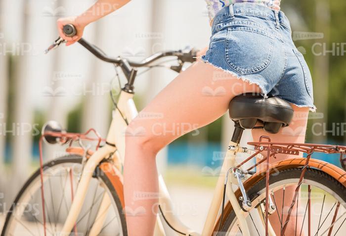 Woman Sitting On Bicycle Stock Photo