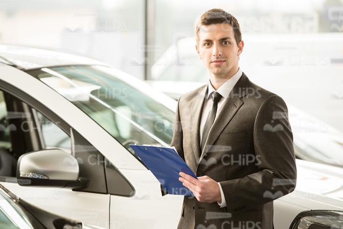 Sales Manager At Car Showroom Stock Photo