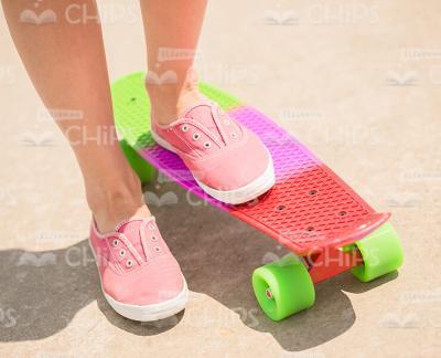 Woman's Legs On Skateboard Stock Photo