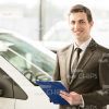 Consultant At Car Store Stock Photo