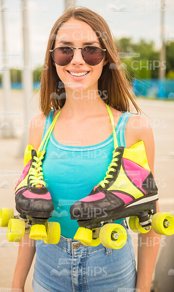 Smiling Girl With Roller Skates Stock Photo