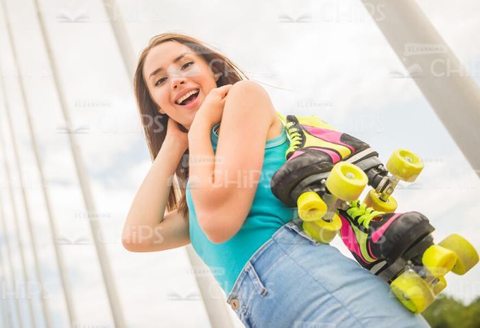 Excited Girl Going To Roller-Skate Stock Photo