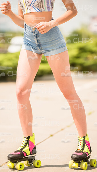 Girl Standing On Roller Skates Stock Photo