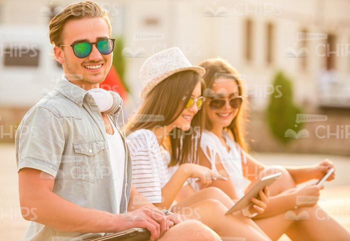 Smiling People Resting Outdoors Stock Photo