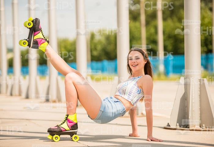 Girl Wearing Rollers And Posing To Photographer Stock Photo