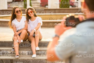 Boy Taking Picture Of Girls On His Camera Stock Photo