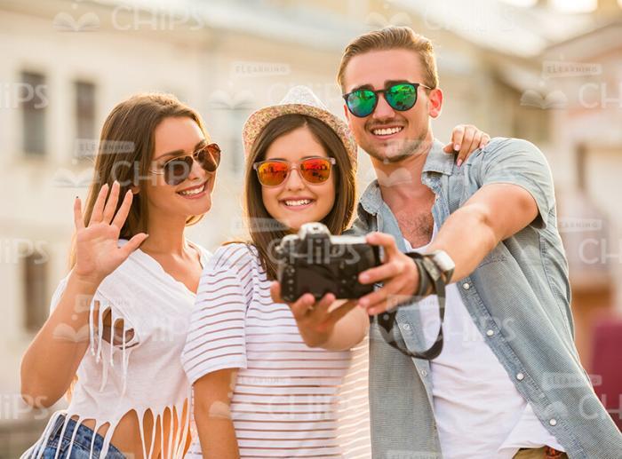 Three Young Friends Taking Selfie On Camera Stock Photo