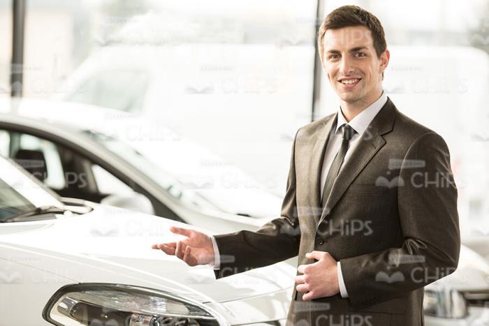 Salesman Showing New Car Stock Photo