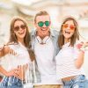 Excited Boy Hugging His Female Friends Stock Photo