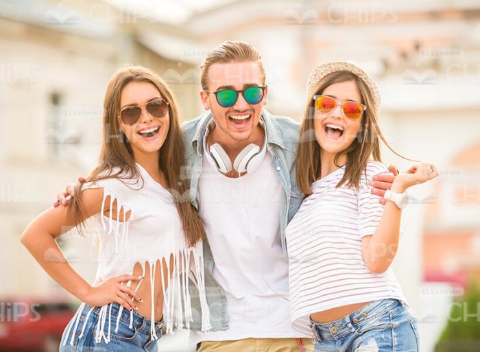 Excited Boy Hugging His Female Friends Stock Photo