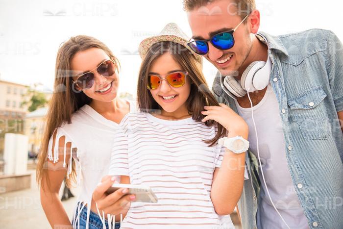 Stock Photo Of Friends Looking On Taken Pictures