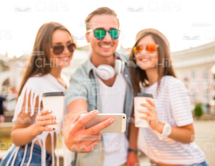 Happy Young Friends Taking Selfie Together