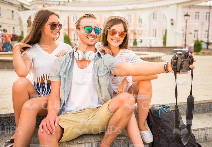 Smiling People Using Camera To Make Selfie Together Stock Photo