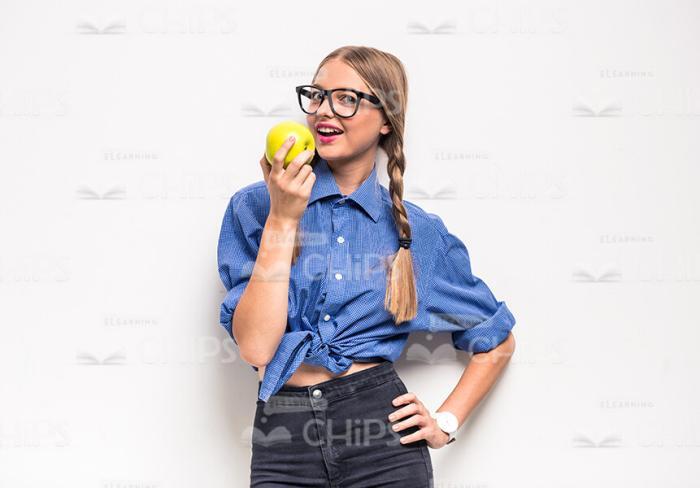 Young Female Student With Apple Stock Photo