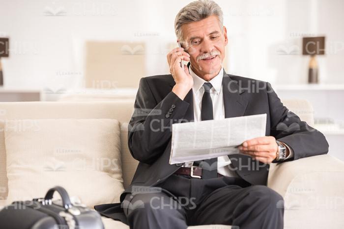 Happy Aged Business Man Reading Newspapers Stock Photo