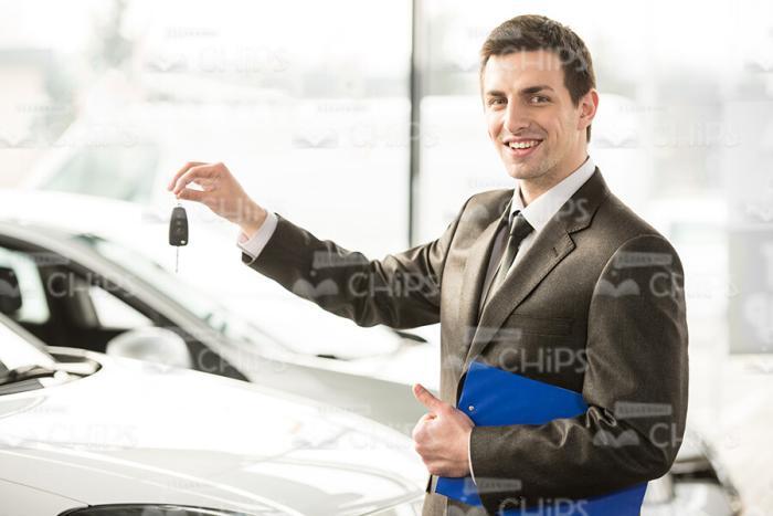 Car Salesman Holding Keys Stock Photo