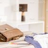 Men's Clothes And Briefcase On Bed Stock Photo