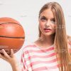 Focused Young Model Holding Basket Ball Stock Photo