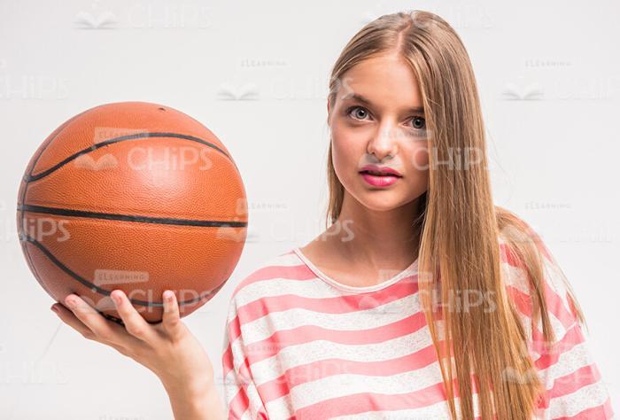 Focused Young Model Holding Basket Ball Stock Photo