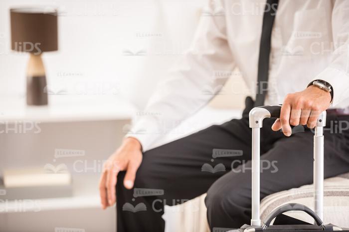 Man's Hand Holding Suitcase Stock Photo