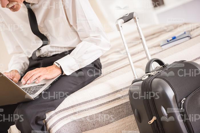 Business Man Using Laptop And Going To Left Hotel Room Stock Photo