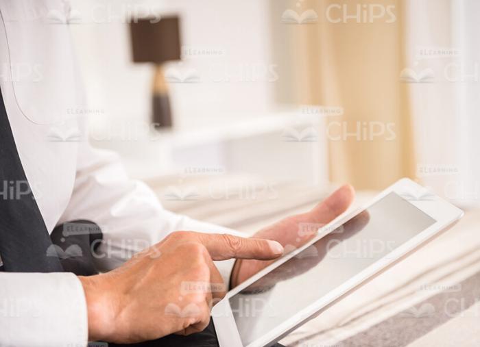 Man's Hands Holding and Using Tablet Stock Photo