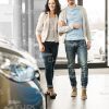 Happy Couple At Car Showroom Stock Photo