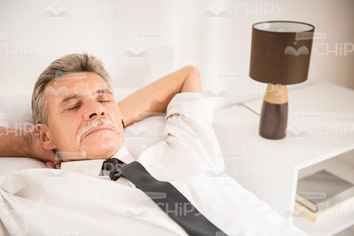 Tired Old Businessman Sleeping Stock Photo
