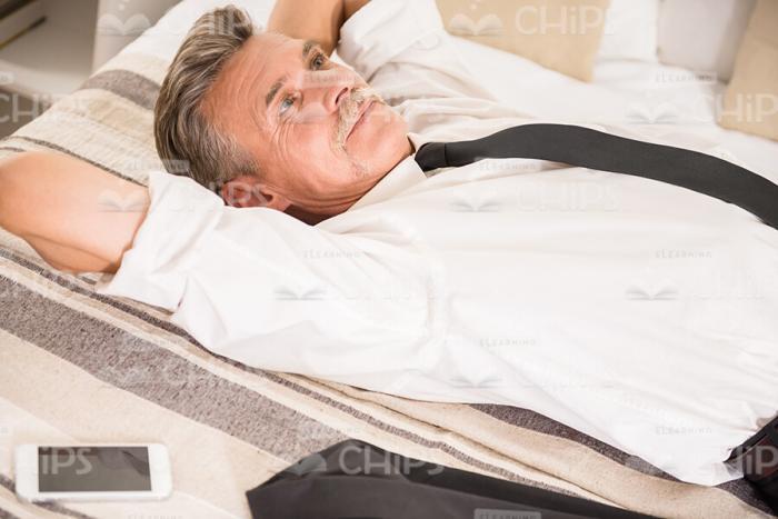 Thoughtful Aged Businessman Resting Stock Photo