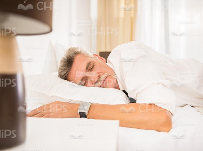 Aged Man Sleeping Stock Photo